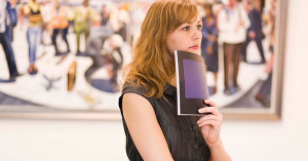 Woman looking at art 